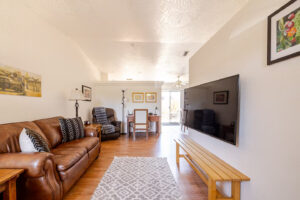 Cozy living room in mid term furnished rental Cottonwood with Smart TV and comfortable seating